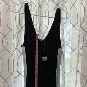 Bebe maxi dress super cute with bling BeBe detail down both sides. NWT size L